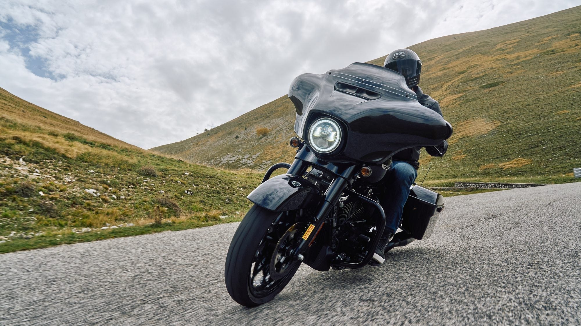 Harley-Davidson Street Glide riding head-on through a mountain pass on Pirelli Diablo Powercruiser tyres