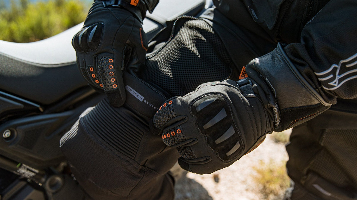 RST glove with orange D3O armour inserts on a motorcycle