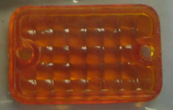 Emgo amber indicator lens. 2.8cm high by 4cm wide. 61-97031